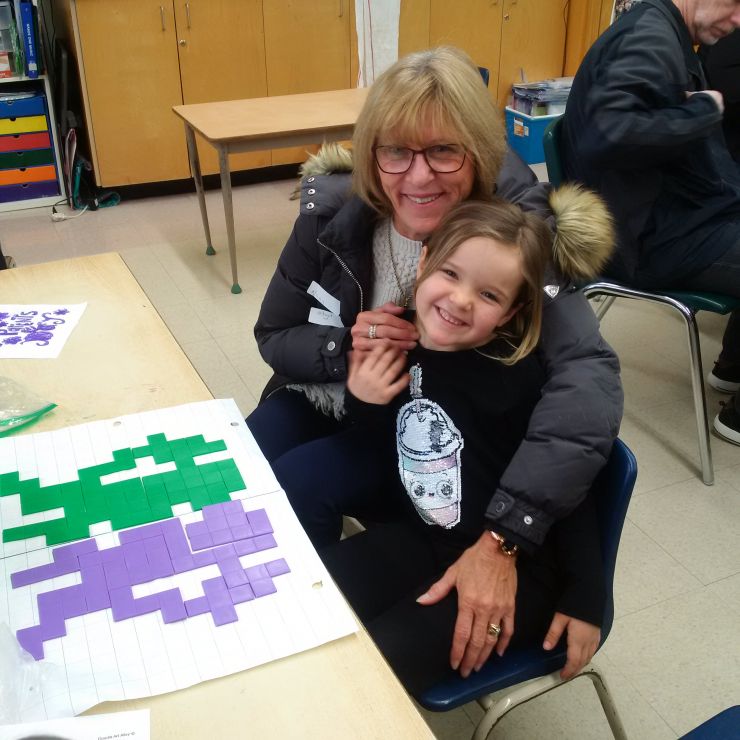 A grandmother and granddaughter take part in Grandparents Day