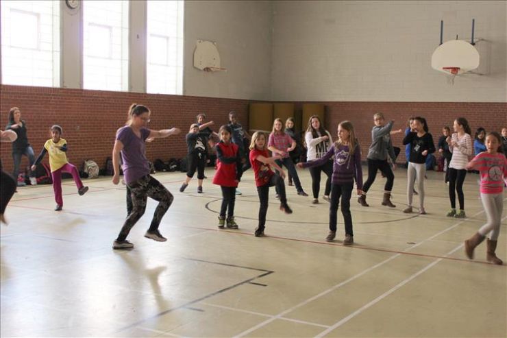 Students participate in a dance class during an Art Soup workshop