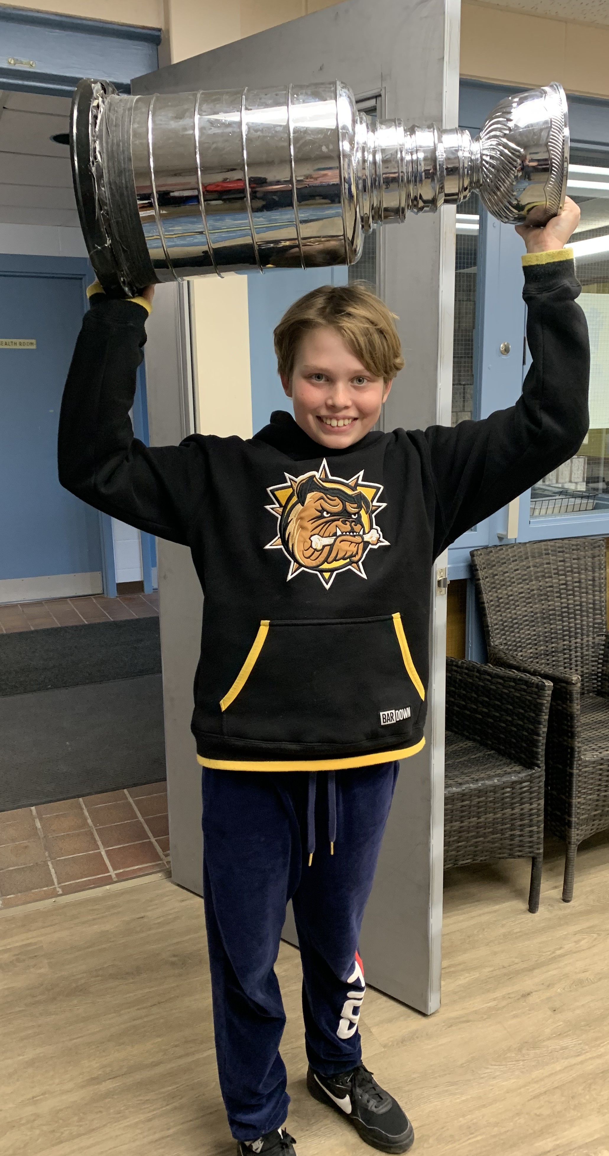 Cohen holding up the cup 