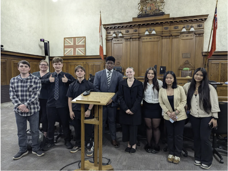Cayuga Secondary School mooting competition team Cayuga Secondary School mooting competition team posing in courtroom