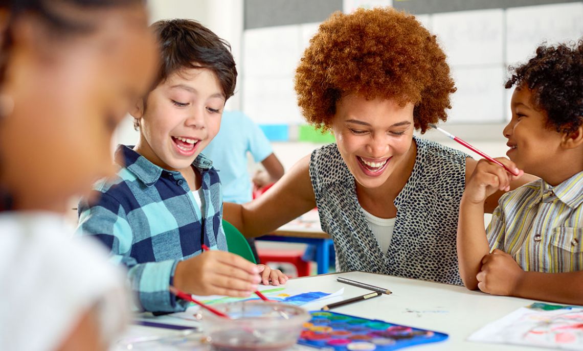 Female teacher with multi-cultural elementary school students