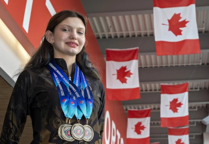 Genevieve Wey wearing swimming medals