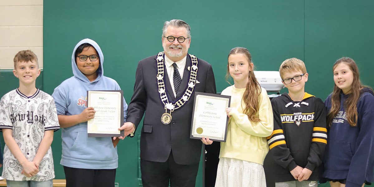Grand Erie changemakers stand with Brant County Mayor Bailey.