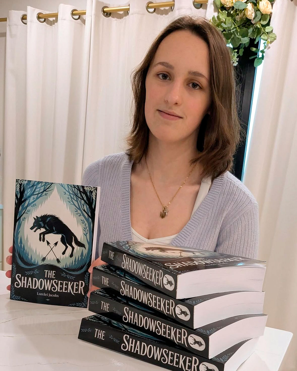Lorelei Jacobs posing with Shadowseeker Book