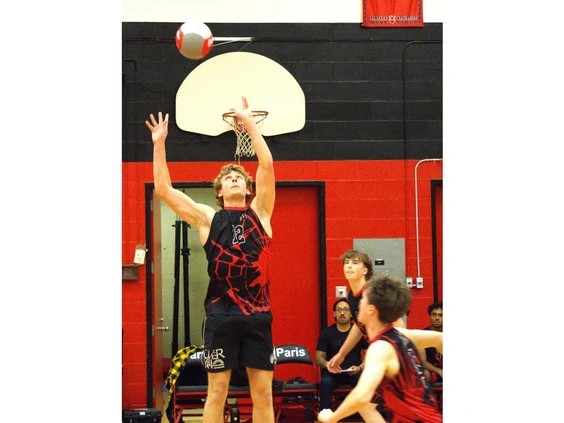 1023-br-hsvball1.br_ Paris District High School's Kalen Johnson sets the ball during an AABHN senior boys volleyball game against McKinnon Park Secondary School on Tuesday at PDHS. Photo by Brian Smiley /jpg, BR, apsmc