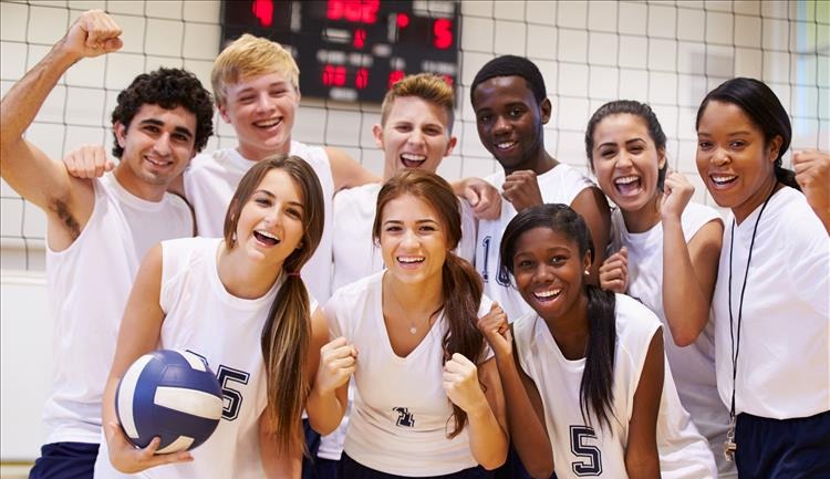 volleyball team posing for a picture