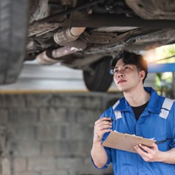 Student working on car