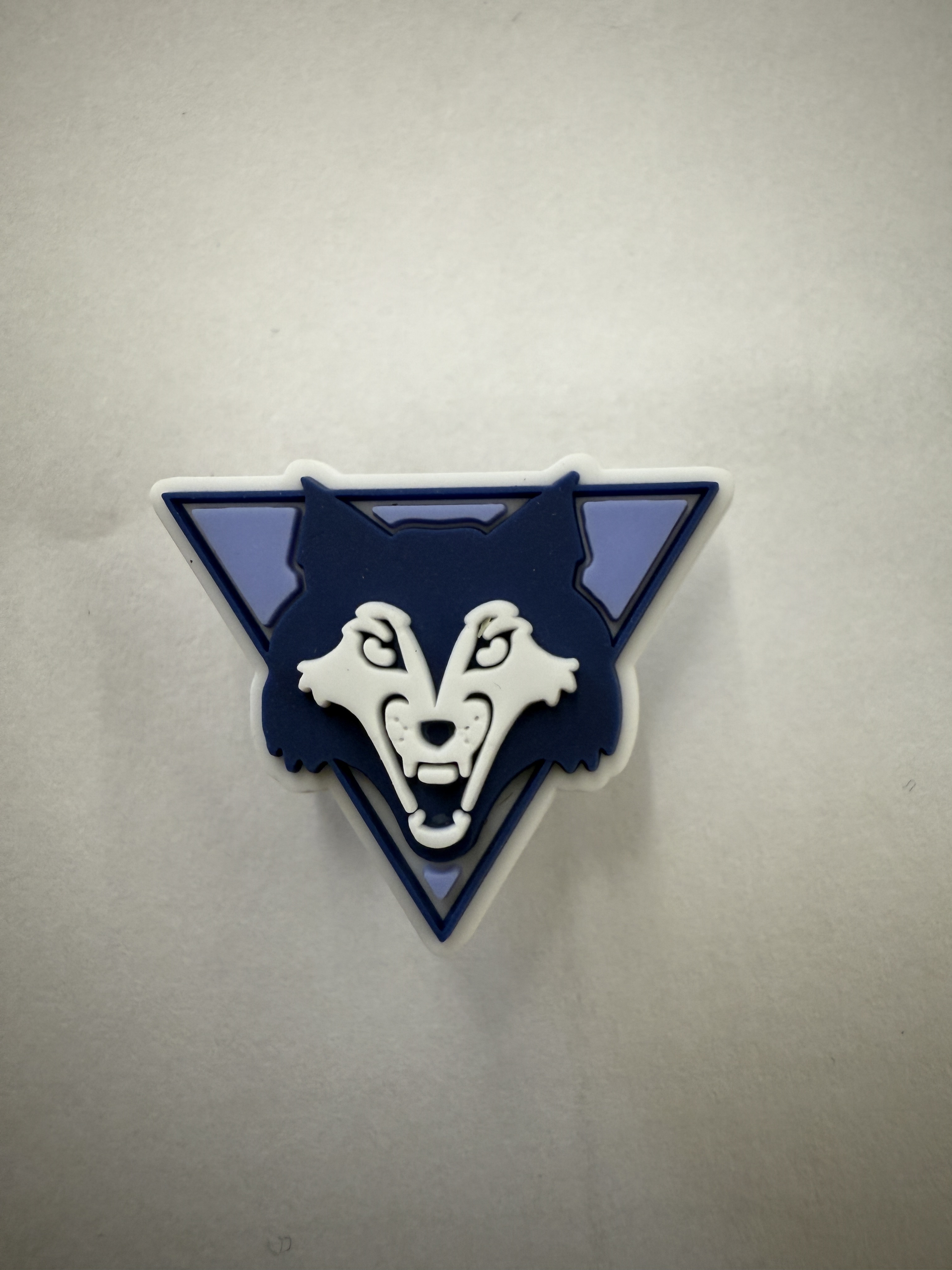 Blue and white Woodman Wolf logo